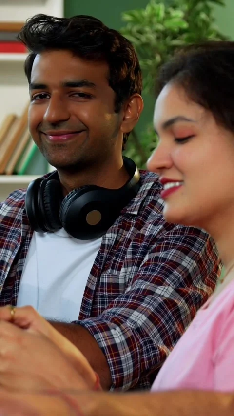 Using laptop, Indian students focus on group study with books notes in library Stock Footage 342385036