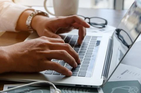 Using laptop for online working. Stock Photos