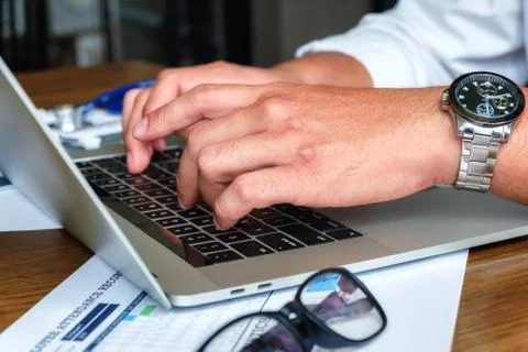 Using laptop for online working. Stock Photos