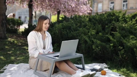 Using laptop, Outdoor workspace, Remote working Stock Footage 257959502