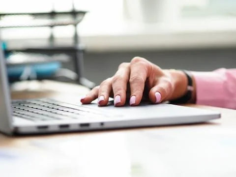 Using laptop for studies or work, hand on keyboard Foto stock