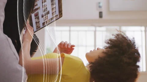 Using laptop, woman browsing online over animated data waves Stock Footage 312848322