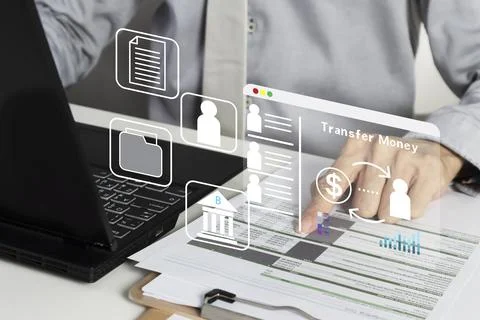 Using laptops to conduct financial transactions, transfer money, pay for go.. Stock Photos