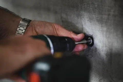 Using a Light-Assisted PowerDrill Stock Photos