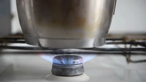 Using a lighter to create a flame on a gas stove. Video stock 183274163