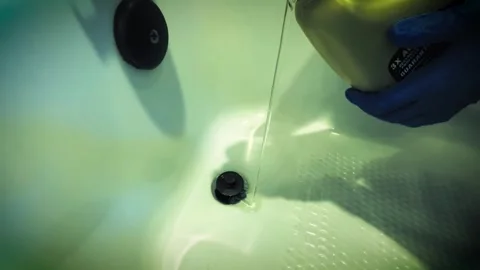 Using liquid plumbing blog removal fluid on a bathtub - Dramatic Color - 1 Stock Footage 283510274