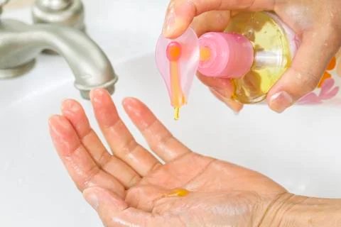 Using liquid soap for washing hands Stock Photos
