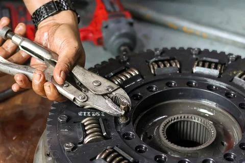 Using Locking Pliers on Transmission Clutch Assembly Bolt. Stock Photos