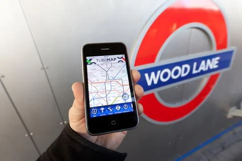 Using a london underground app Stock Photos