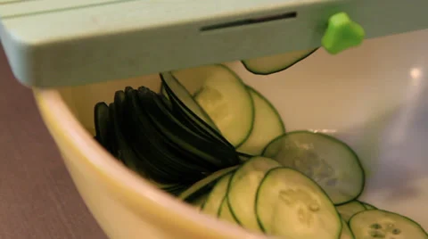 Using a Mandolin Slicing Cucumbers Stock Footage 37416595