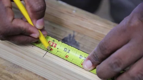 Using a measuring tape in caprentry and joinery woodwork Stock Footage 163280619
