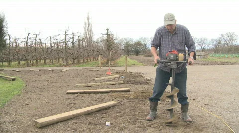 Using a mechanical auger Stock Footage 459741