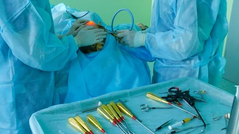 Using a medical video endoscope with a scraper, a doctor lifts the skin on a per Stock-Footage 123575458