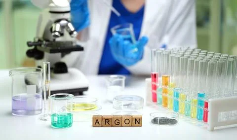 Using a microscope and lab equipment, we observe colorful solutions and take Stock Photos