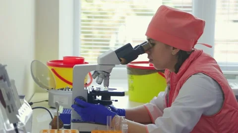 Using of a microscope in the laboratory Stock Footage 234814051