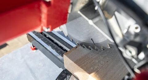 Using a miter saw to cut a piece of wood. Own carpentry workshop. Sawing a wo Stock Photos