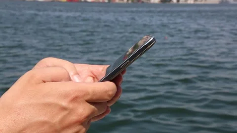 Using Mobile Phone On Beach Close Up Stock Footage 338122257