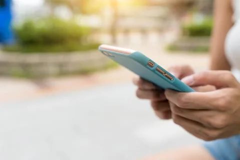 Using mobile phone in the evening Stock Photos