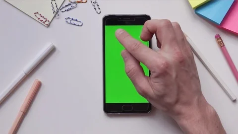 Using Mobile Phone with Green Screen on Designer's Table. Great For Mock-up Stock Footage 74901040