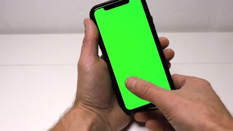 Using a mobile-phone with green screen Stock Footage 121671482