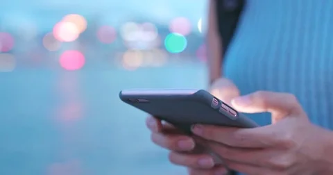 Using mobile phone at outdoor Stock Footage