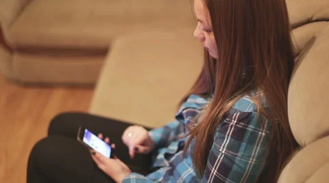Using mobile phone while relaxing on the bed: social networks, internet Stock Footage 56395024