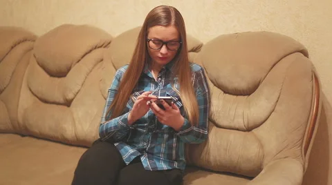 Using mobile phone while relaxing on the bed: social networks, internet. Stock Footage 56426407