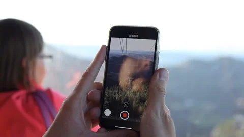 Using a mobile phone, a young man makes a report for Instagram about traveling. Video stock 121485473