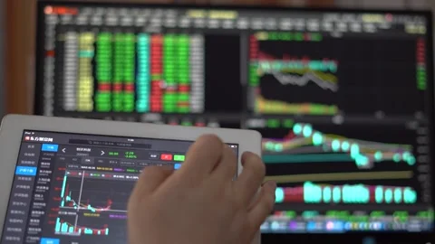Using mobile phones and tablet computers to speculate and analyze the stock  Stock Footage 158152944
