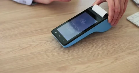 Using a mobile POS system to process a customer's credit card Stock Footage 271224129