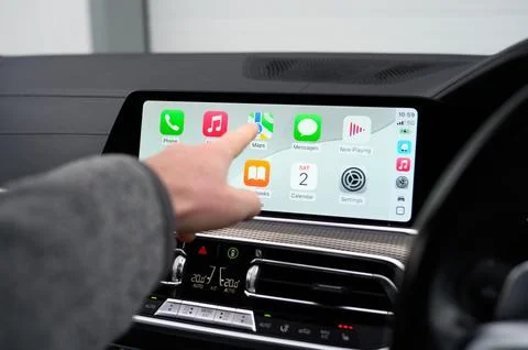 Using Modern BMW 330e with Apple CarPlay Display Stock Photos
