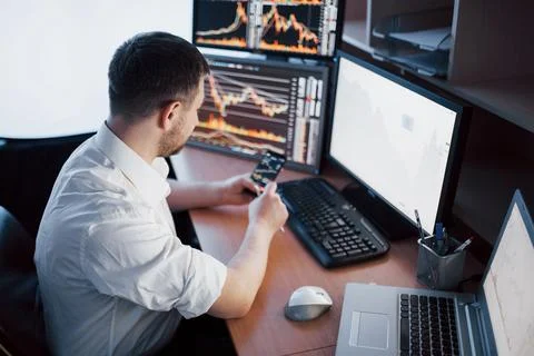 Using modern technologies at work. Young businessman working on digital tab.. Stock Photos