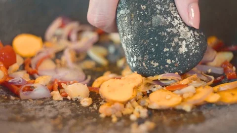 Using mortar and pestle on balinese cooking class Stock Footage 85008563