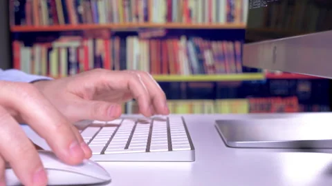 Using Mouse And Keyboard In Library Stock Footage 147752624