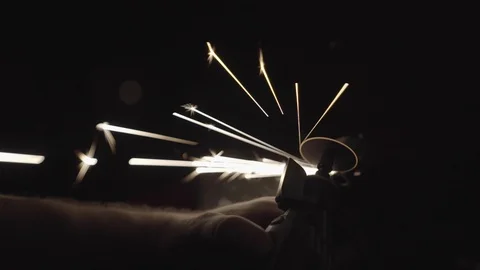 Using a multi tool with sparks in a dark lit room Stock Footage 125446155
