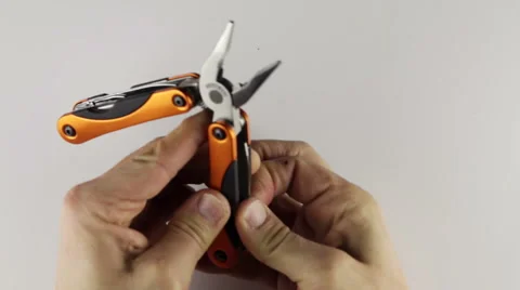 Using a multitool 動画素材 45942717