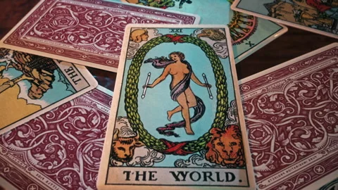 Using the mystery divination spell to read magical The World Tarot Card Stock Footage 251183983