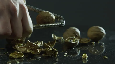 Using nutcracker to crack walnuts Stock-Footage 67359365