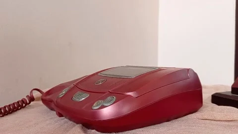 Using an old home phone with color maroon Stock Footage 149709563
