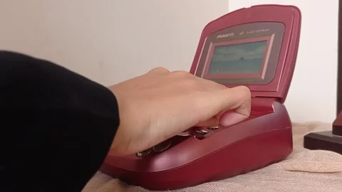 Using an old home phone with color maroon Stock Footage 149709631