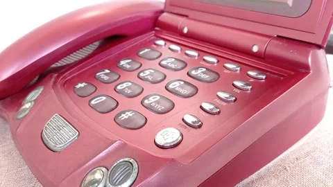 Using an old home phone with color maroon Stock Footage 149709741