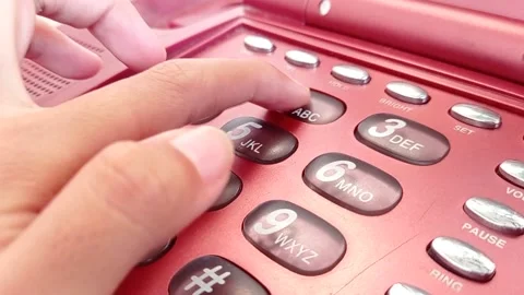 Using an old home phone with color maroon Stock Footage 149709758