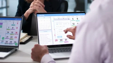 Using Online Calendar In Manager Meeting Stock Footage 303661144