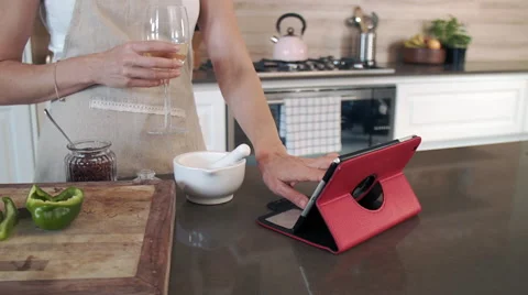 Using online recipe on device to cook Stock Footage 60793566