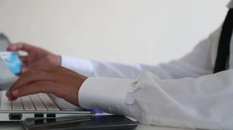 Using online shopping credit card laptop Stock Footage