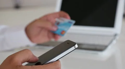 Using the online shopping mobile phone credit card Stock Footage 67884304