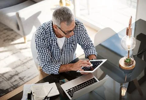 Using online tools to manage and analyze financial accounts. High angle shot  Stock Photos