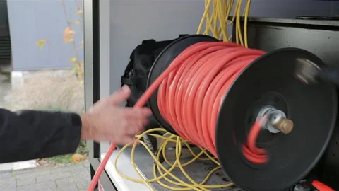 Using a osmosis water hose reel Stock Footage