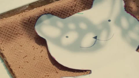 Using An Outline Of A Bear Pattern On Fabric At Build-A-Bear Workshop - Close Up Stock Footage 298161031