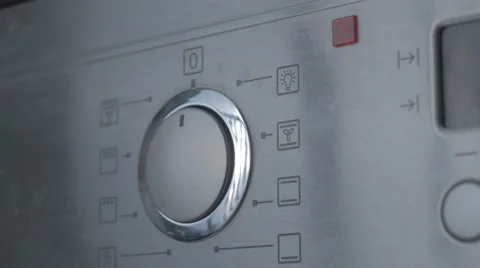 Using the Oven, oven temperature control closeup Stock Footage 43224560